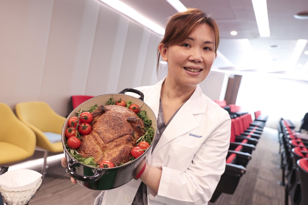 Dietitian June Chan holds her sourdough bread shaped like a Christmas turkey at the OSC fundraiser at Hong Kong Sanatorium and Hospital. Photo: Sam Tsang