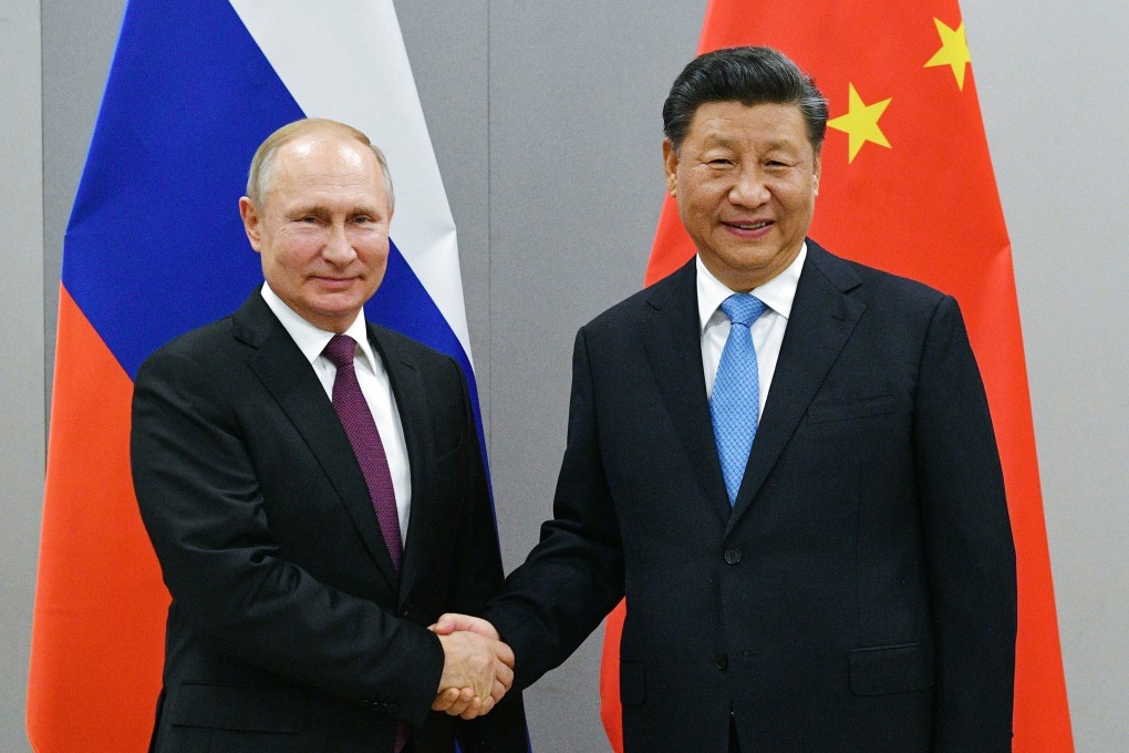 Russian President Vladimir Putin and Chinese President Xi Jinping shake hands prior to their talks on the sideline of the the BRICS Summit in Brazil in 2019. Photo: AP