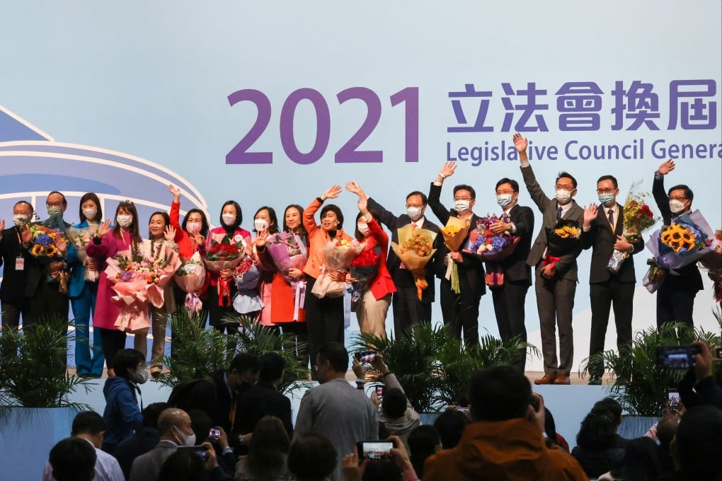 Newly elected lawmakers celebrate their win at the Hong Kong Convention and Exhibition Centre in Wan Chai on Monday. Photo: Nora Tam