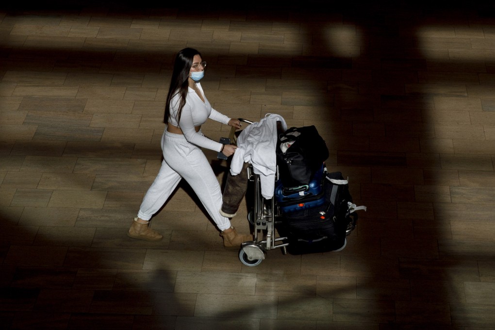 A masked passenger at Ben Gurion International airport in Tel Aviv, Israel. File photo: Bloomberg