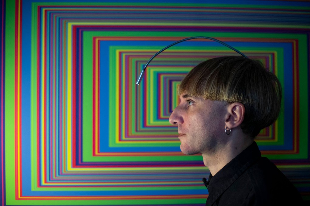 “Cyborg” artist Neil Harbisson designed an antenna to overcome his colour blindness that lets him hear colours through bone conduction, allowing him to paint portraits - including those of actors Tom Cruise and Leonardo DiCaprio. Photo: Josep Lago/AFP