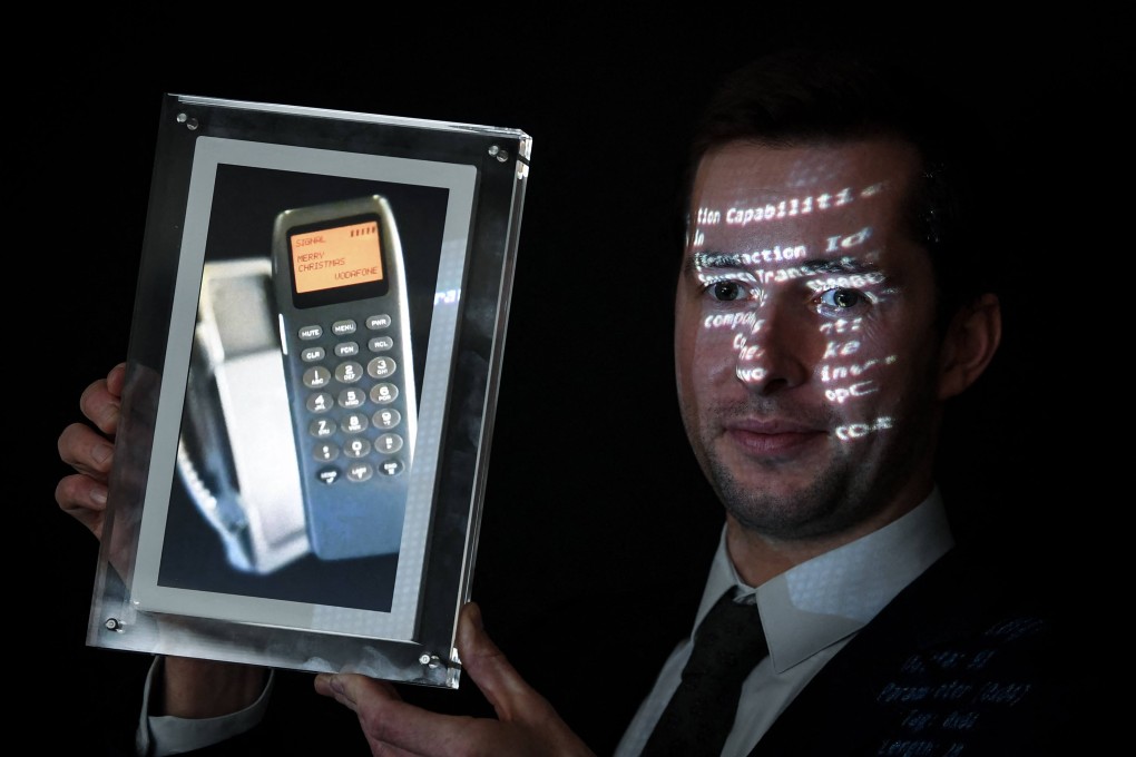 A phone with the world’s first SMS, which was auctioned at the Aguttes auction house in Paris. Photo: AFP / DPA