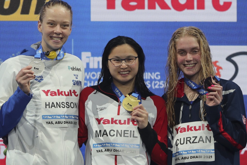 Frome the left, Louise Hanson of Sweden, silver, World Swimming Championships 100m butterfly event gold medal winner Margaret MacNeil of Canada (centre) with silver medallist Louis Hanson (left) of Sweden and bronze medallist Claire Curzan (right) of the US in Abu Dhabi. Photo: AP