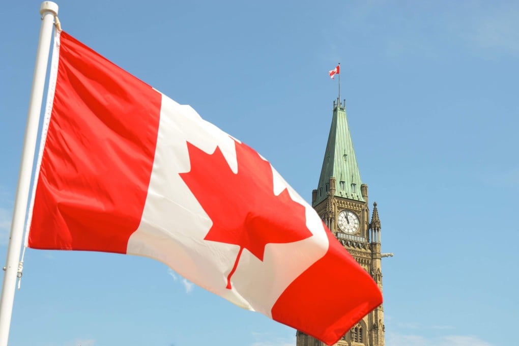 The Canadian flag waves in front of the Parliament Building on Parliament Hill in Ottawa, in this file photo. Photo: Jason Hafso/Unsplash