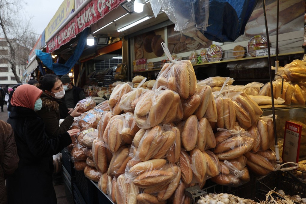 Women shop for bread at a market in Ankara, Turkey, on December 20. Inflation in food prices and other areas remains a concern around the world as some of the leading central banks pivot to a more hawkish stance on interest rates. Photo: AFP
