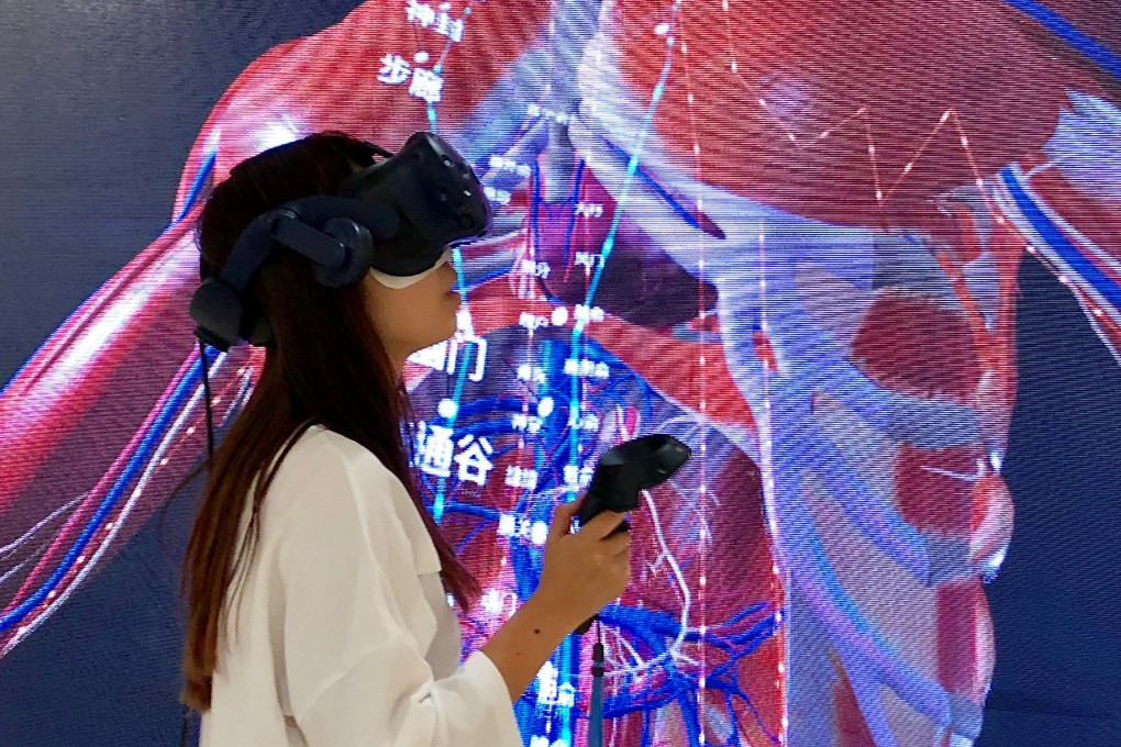 A student at Beijing University of Chinese Medicine uses augmented reality technology to study acupuncture in October 2018. Photo: BodyMap