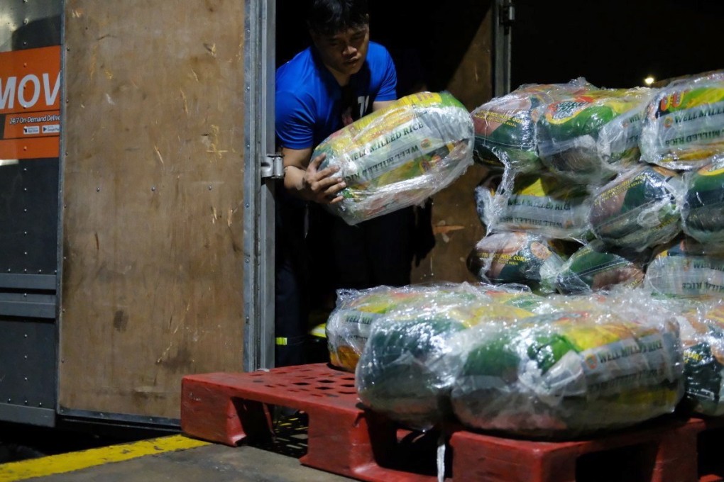 A worker unloads relief goods in Cebu, in the Philippines, on December 19. While there is a clear imperative for providing emergency relief funds, long-term foreign aid projects often fail to meet their aims because of short-sighted planning. Photo: EPA-EFE