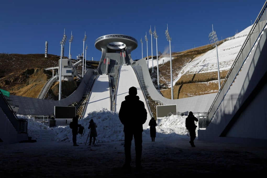 Journalists stand at the National Ski Jumping Centre during a government-organised media tour to Beijing 2022 Winter Olympics venues in Zhangjiakou, Hebei province, on December 21, 2021. Photo: Reuters