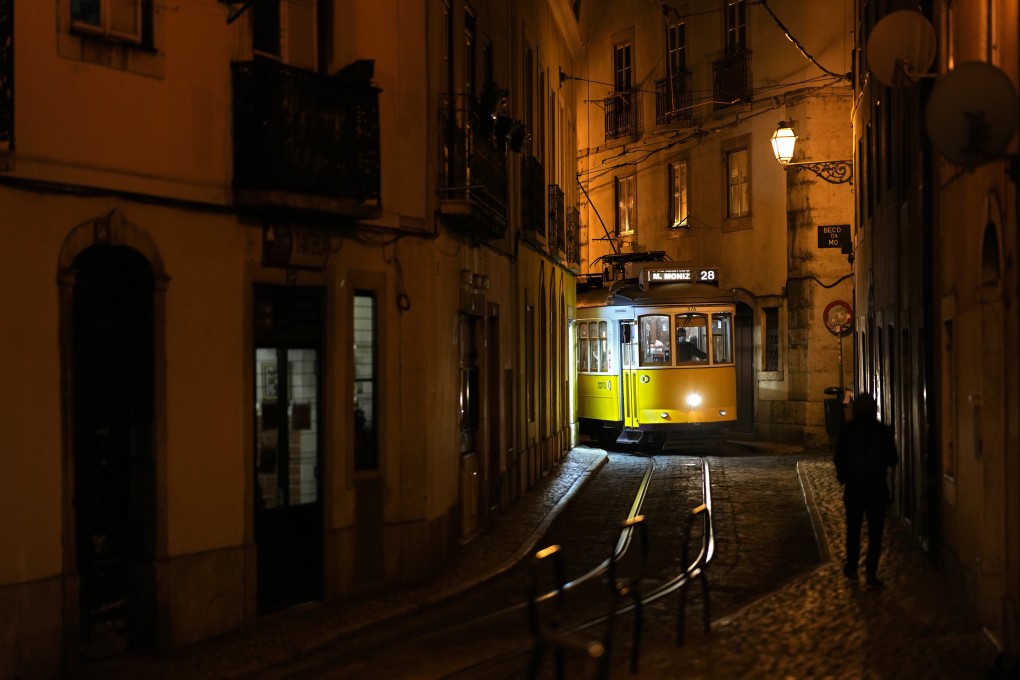 A tram makes its way through a narrow street in Lisbon’s old Alfama neighbourhood. Photo: AP