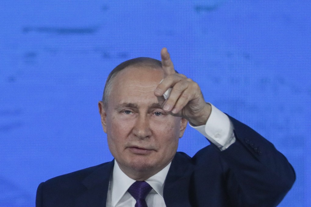 Russian President Vladimir Putin answers questions during his annual news conference. Photo: EPA