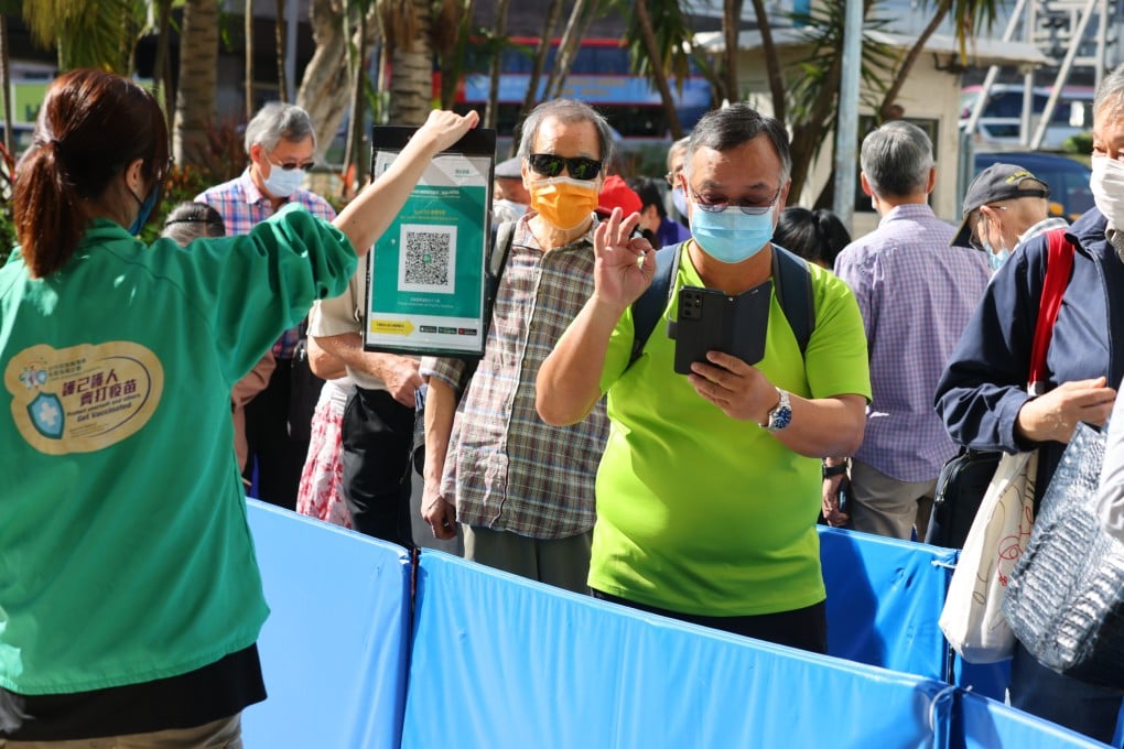Eligible residents queue for BioNTech booster shots last month at the Sun Yat Sen Memorial Park Sports Centre. Photo: Dickson Lee