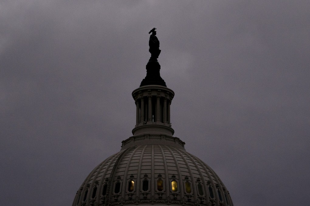 Clouds gather over the US Capitol in Washington on December 10 when the Senate passed legislation creating a fast track to raising the nation’s debt ceiling. The US government’s rising fiscal debt is a factor that could constrain the Fed’s ability to raise interest rates. Photo: Bloomberg