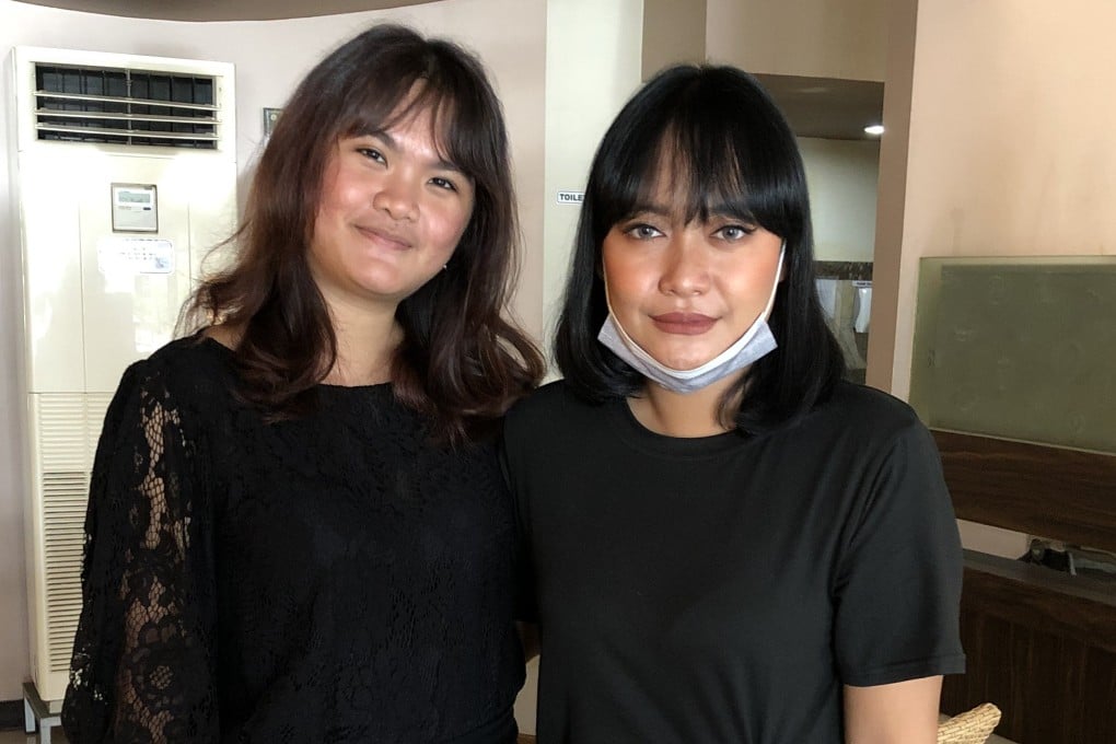 Stella Monica Hendrawan, left, with Anindya Shabrina Joediono, secretary of the Association for Victims of the ITE Law (PAKU ITE). Photo: Handout