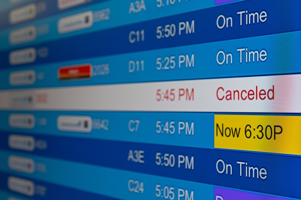 Cancelled flights on an electronic board at Washington Dulles International Airport, Virginia, US. Photo: Bloomberg