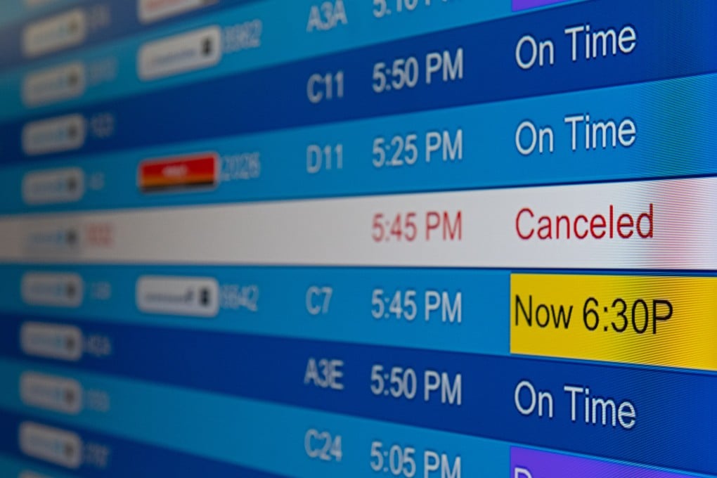 Cancelled flights on an electronic board at Washington Dulles International Airport, Virginia, US. Photo: Bloomberg