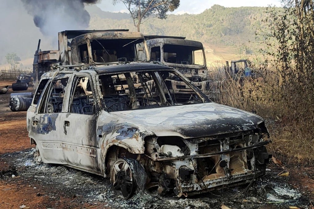 Vehicles smoulder in Kayah state, Myanmar, where women and children, were shot dead. Photo: AP