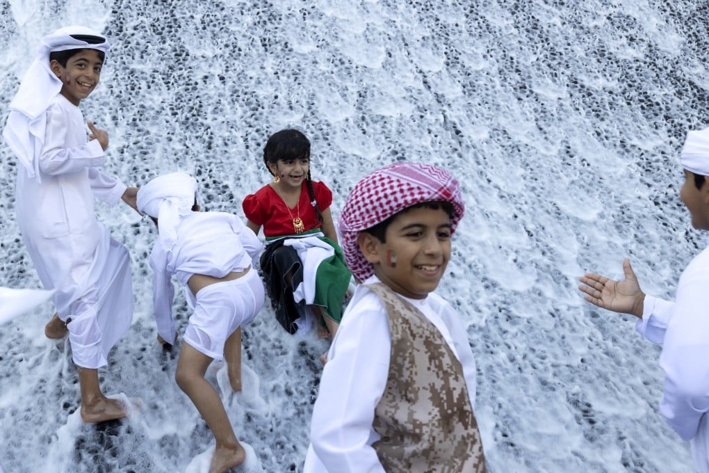 Children play at the Expo 2020 Water Feature during the Expo 2020 Dubai in the United Arab Emirates. Photo: Palani Mohan/Expo 2020 Dubai