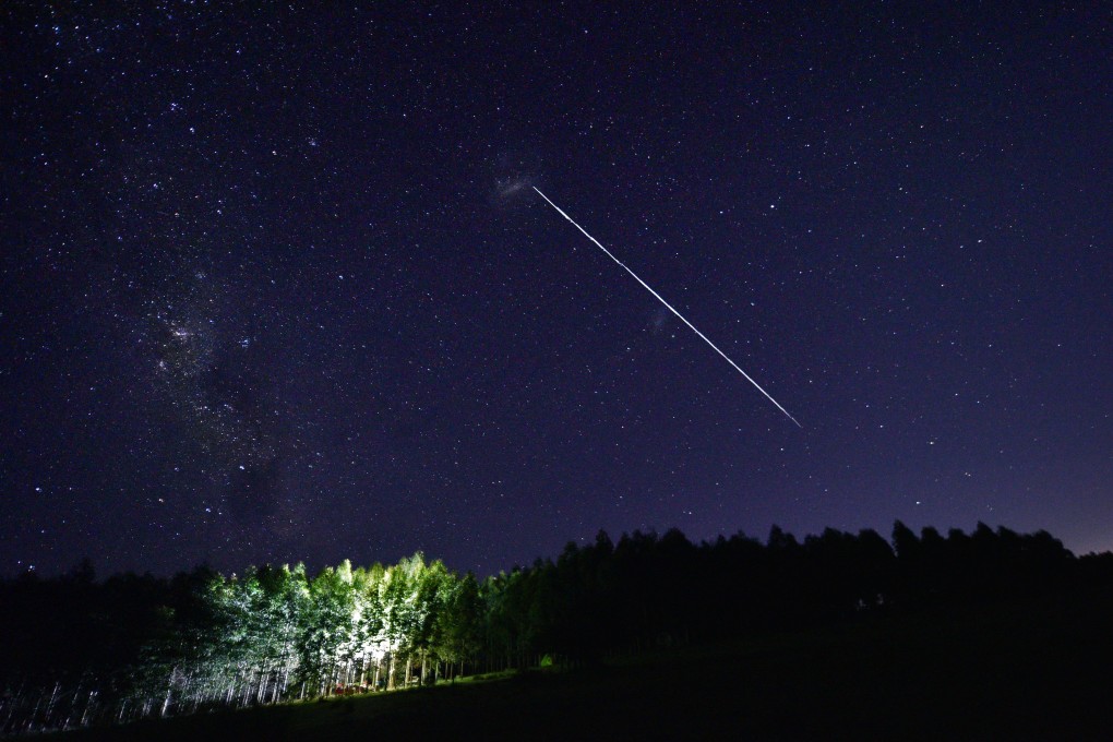 A trail from a group of Starlink satellites, which have been accused of approaching China’s space station. Photo: AFP