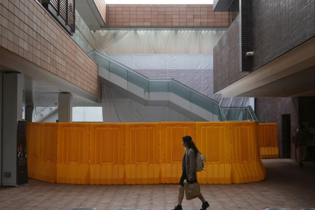 A woman walks past the site at the University of Hong Kong where the Pillar of Shame statue, a memorial to the Tiananmen crackdown, stood for more than 20 years before being removed on December 23. Photo: AP