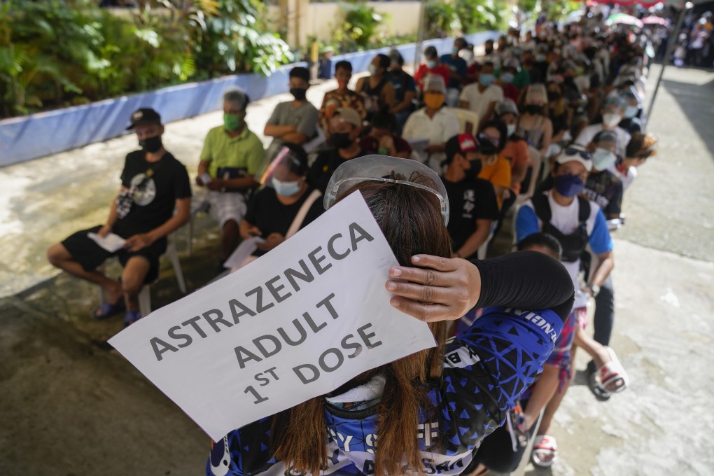 Residents queue up for their Covid-19 vaccines at a school in Quezon city, Philippines, on November 29, the first day of a nationwide three-day vaccination drive. Some developing countries, including the Philippines, have had to go into debt to support their vaccination programme. Photo: AP