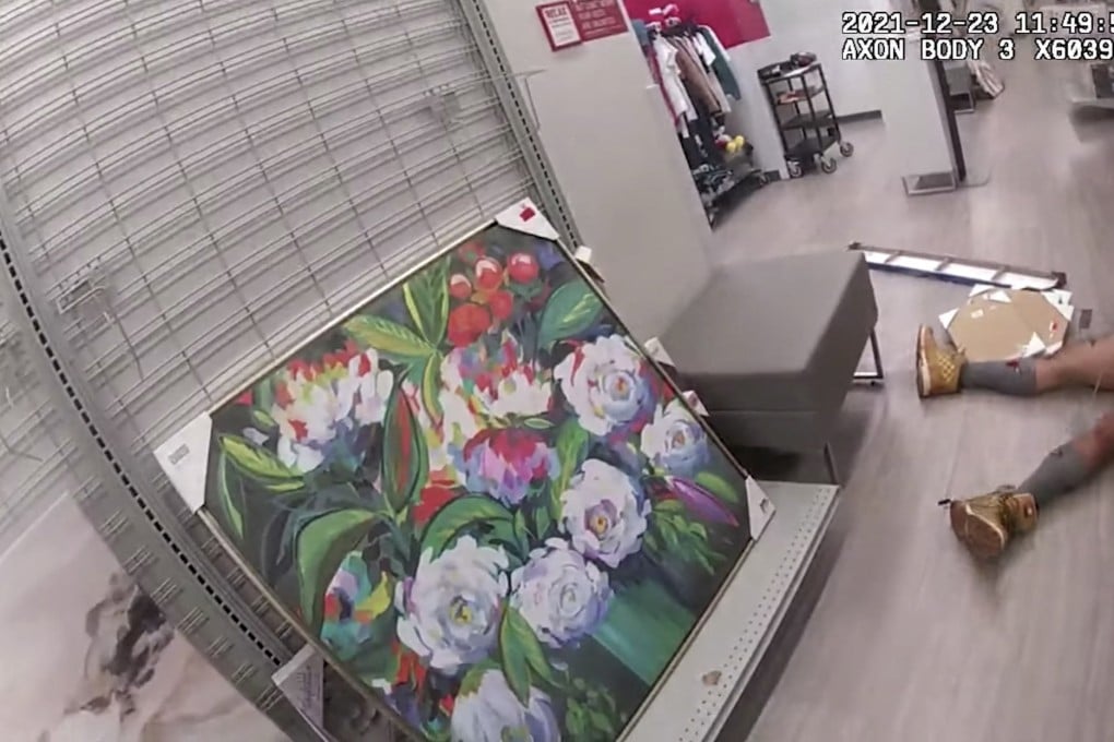 An image released by Los Angeles Police on December 27 shows an assault suspect at a clothes shop lying on the ground after being shot by a police officer. Photo: Los Angeles Police Department / AFP