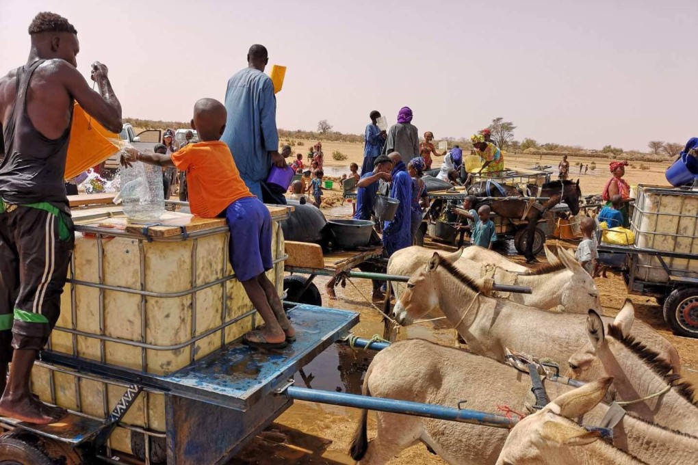 People collect water from a China-funded well in a village in Senegal in August 2018. The well-drilling project was one outcome from the Forum on China-Africa Cooperation summit in 2015. The competition for influence is an opportunity for Africa to fast-track its development. Photo: Xinhua