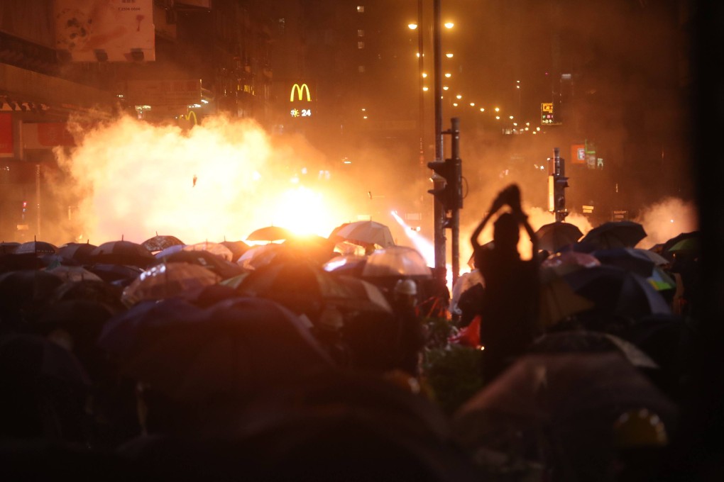 Anti-government protesters clash with riot police on Nathan Road, Yau Ma Tei on November 18, 2019. Photo: Winson Wong