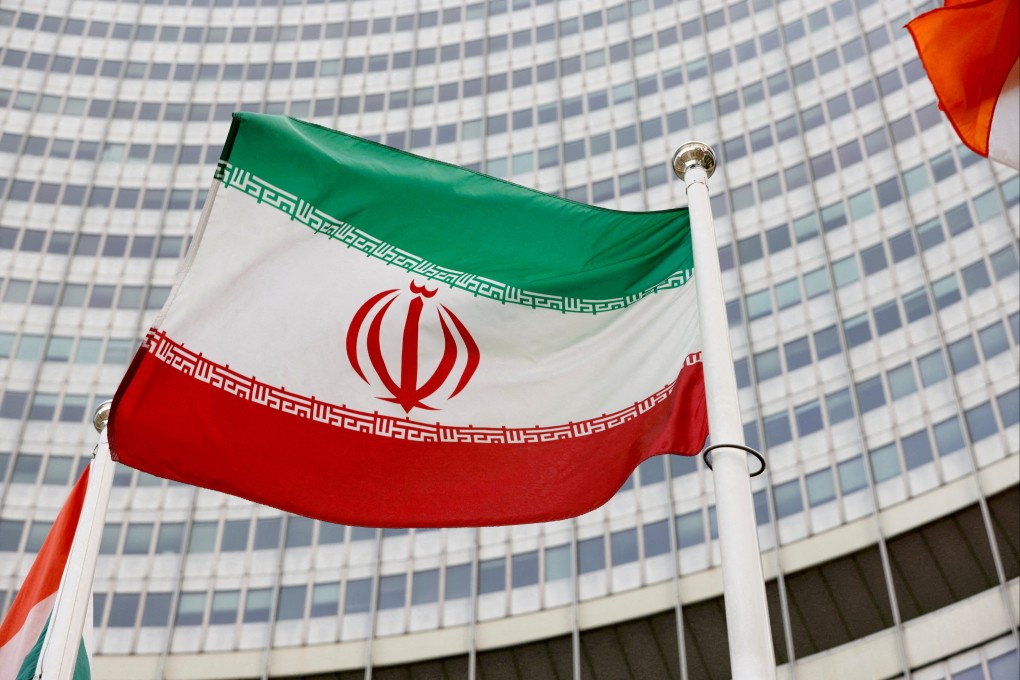 The Iranian flag waves in front of the International Atomic Energy Agency headquarters in Vienna in May. Photo: Reuters