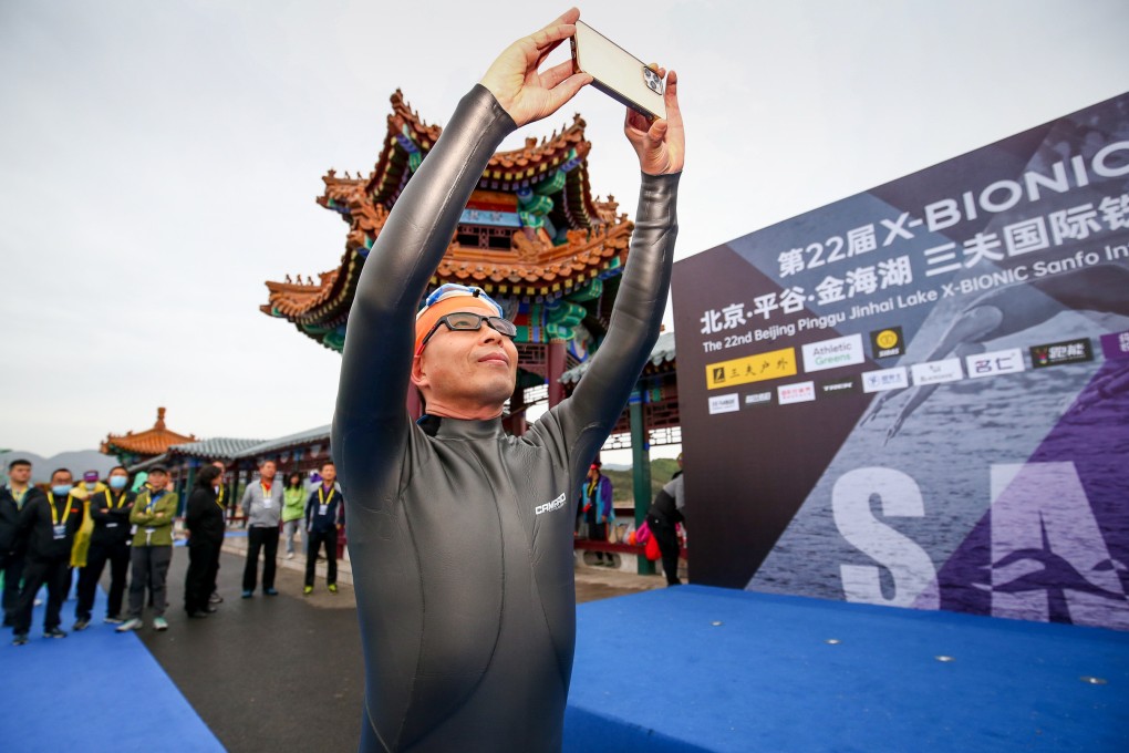 Zhang Heng, 51, participated in a triathlon organised by his company Sanfo at Jinhai Lake in Beijing in 2021. He founded the outdoor sports equipment company 25 years ago.