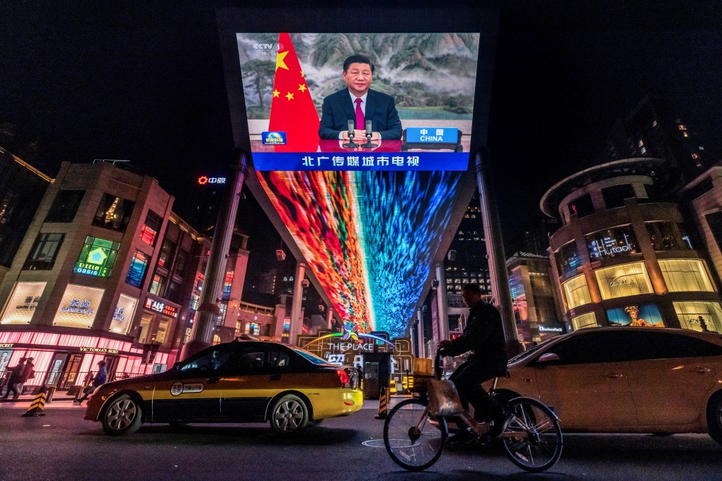 A screen displays a broadcast of President Xi Jinping in Beijing on October 31. Photo: Reuters