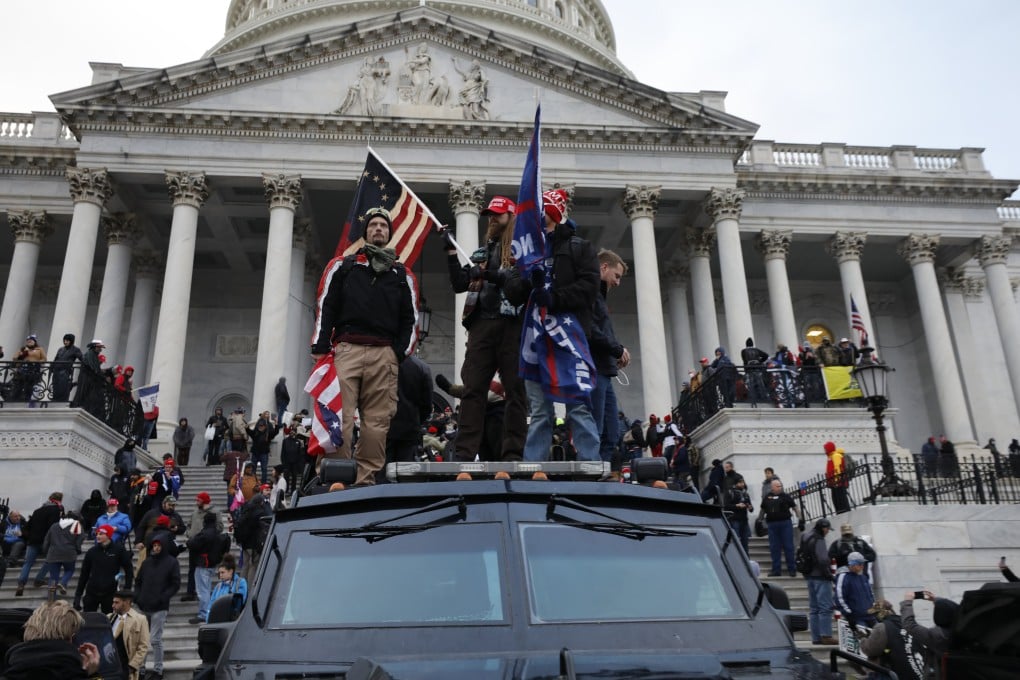 Supporters of US president Donald Trump riot at the US Capitol building in Washington on January 6. Multiple reports have detailed the trend of democratic backsliding and the rise of more authoritarian governance. Photo: TNS