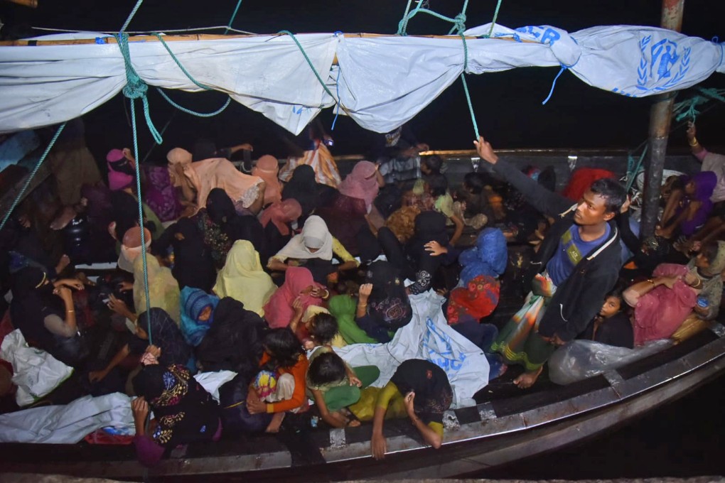 Rohingya refugees arrive in a wooden boat at Krueng Geukueh Port in North Aceh, Indonesia. Photo: AP