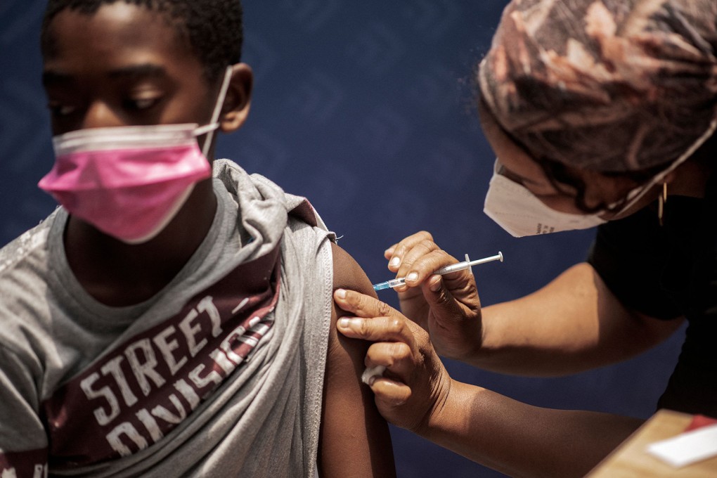A boy receives a dose of the Pfizer/BioNTech vaccine in Johannesburg. Photo: AFP via Getty Images/TNS