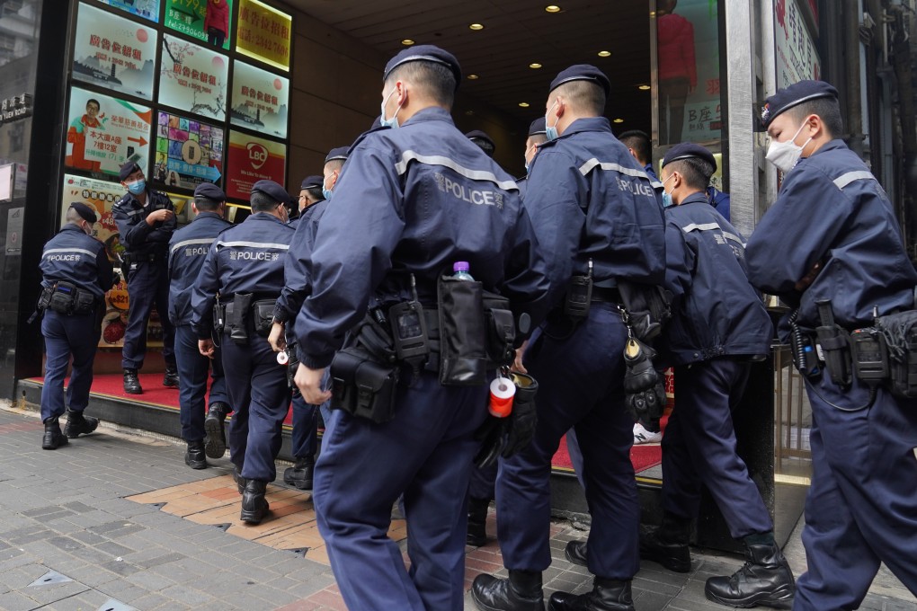 Hong Kong police raid the offices of Stand News, which shut down after seven people linked to the portal were arrested. Photo: Sam Tsang