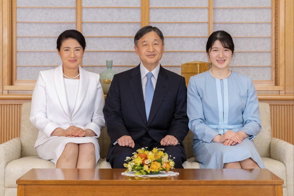 Japan’s Emperor Naruhito, Empress Masako, left, and their daughter Princess Aiko pose for a photo during a family portrait session ahead of the New Year. Photo: AP