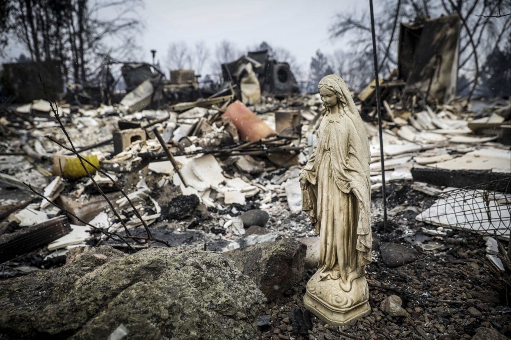 A statue of the Virgin Mary amid the rubble of a home after a fire burned through Boulder, Colorado on December 30. Photo: Getty Images / AFP