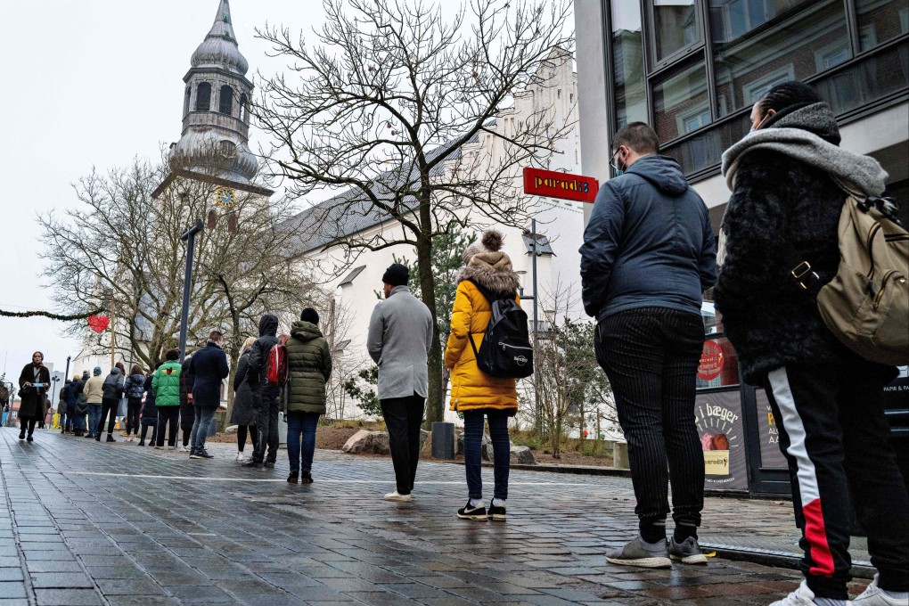 People queue at a coronavirus test centre in Aalborg, Denmark. Photo: AFP