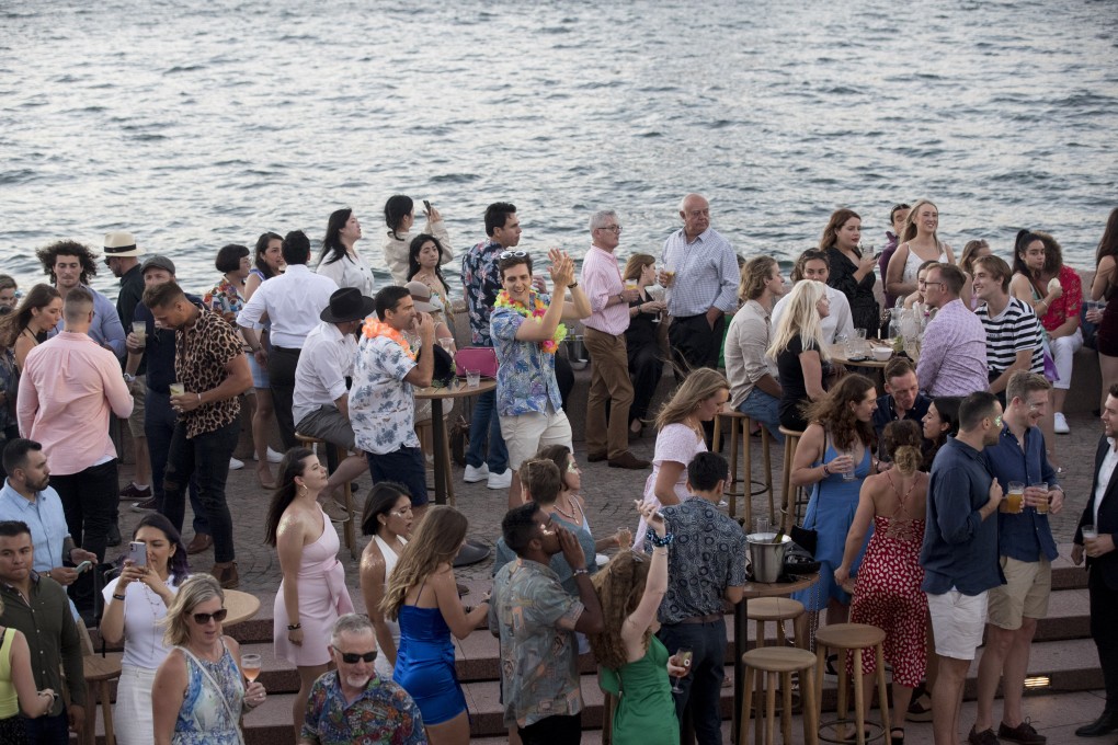 Revellers gather at Opera Bar during New Year’s Eve celebrations in Sydney, Australia. Photo: Bloomberg