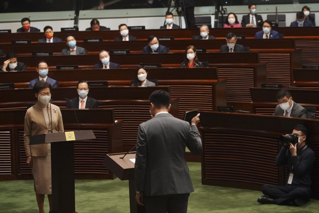 Chief Executive Carrie Lam (left) officiated at the oath-taking ceremony for members of Hong Kong’s new Legislative Council. Photo; Felix Wong