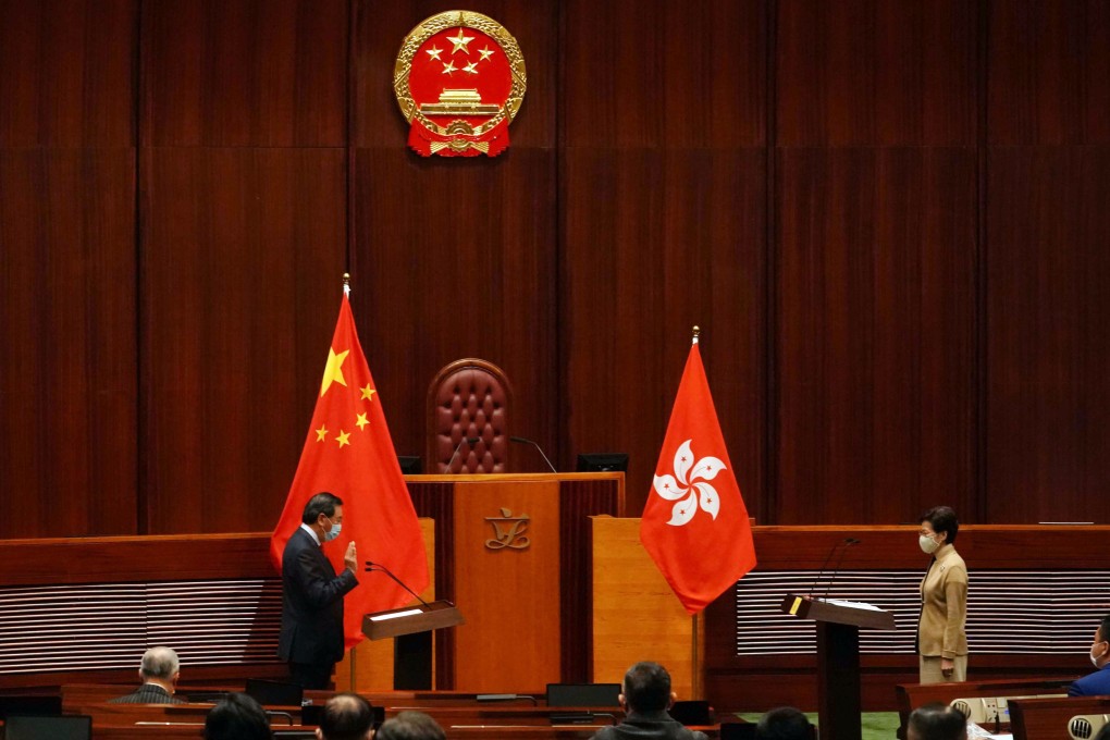 Former Legco president and new lawmaker Andrew Leung (left) delivers his oath in front of Hong Kong leader Carrie Lam. Photo: Felix Wong