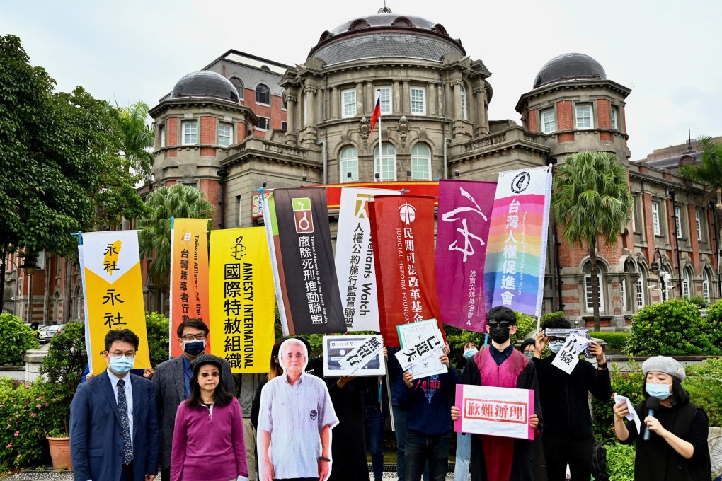 Activists campaign at the Control Yuan in Taipei with a life-sized placard of Taiwan’s oldest death row inmate Wang Xin-fu. Photo: AFP