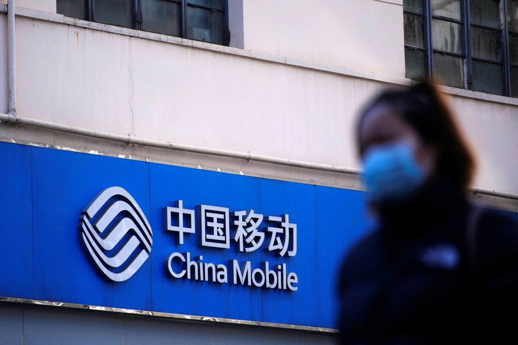 A sign of China Mobile is seen on a street in Shanghai in January 2021. Photo: Reuters