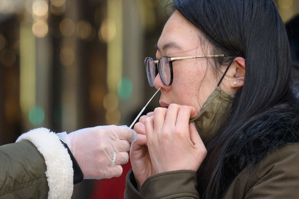 A woman receives a Covid-19 test in New York City. The US recorded more than 1 million Covid-19 cases on January 3, 2022, according to data from Johns Hopkins University. Photo: AFP