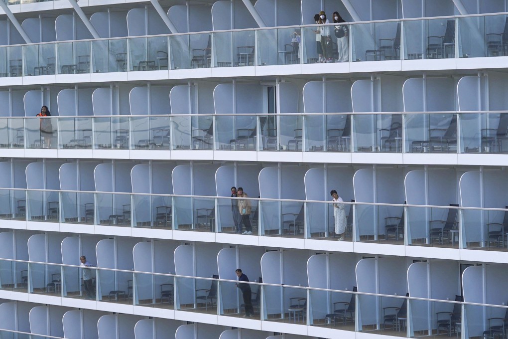 Spectrum of the Seas passengers wait to get tested after their trip was cut short by a day over a feared Covid-19 cluster. Photo: Sam Tsang