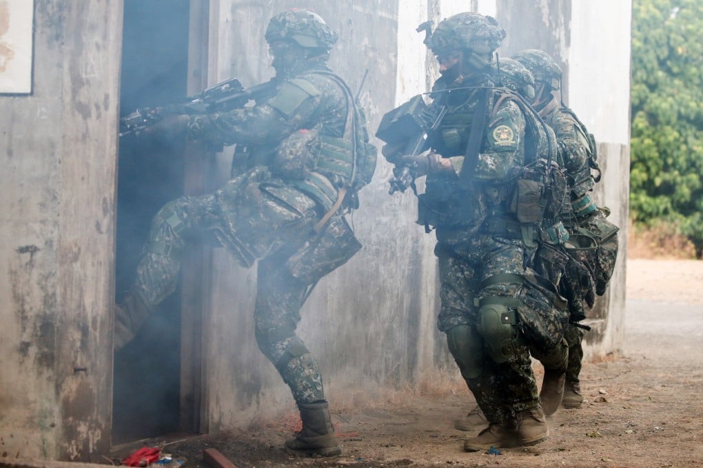 Taiwanese soldiers take part in the drill in a mock-up town in Kaohsiung on Thursday. Photo: Bloomberg