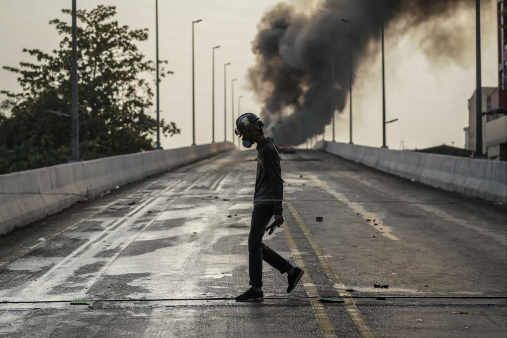 A demonstrator walks along a bridge during a protest against the military coup in Myanmar. Photo: EPA