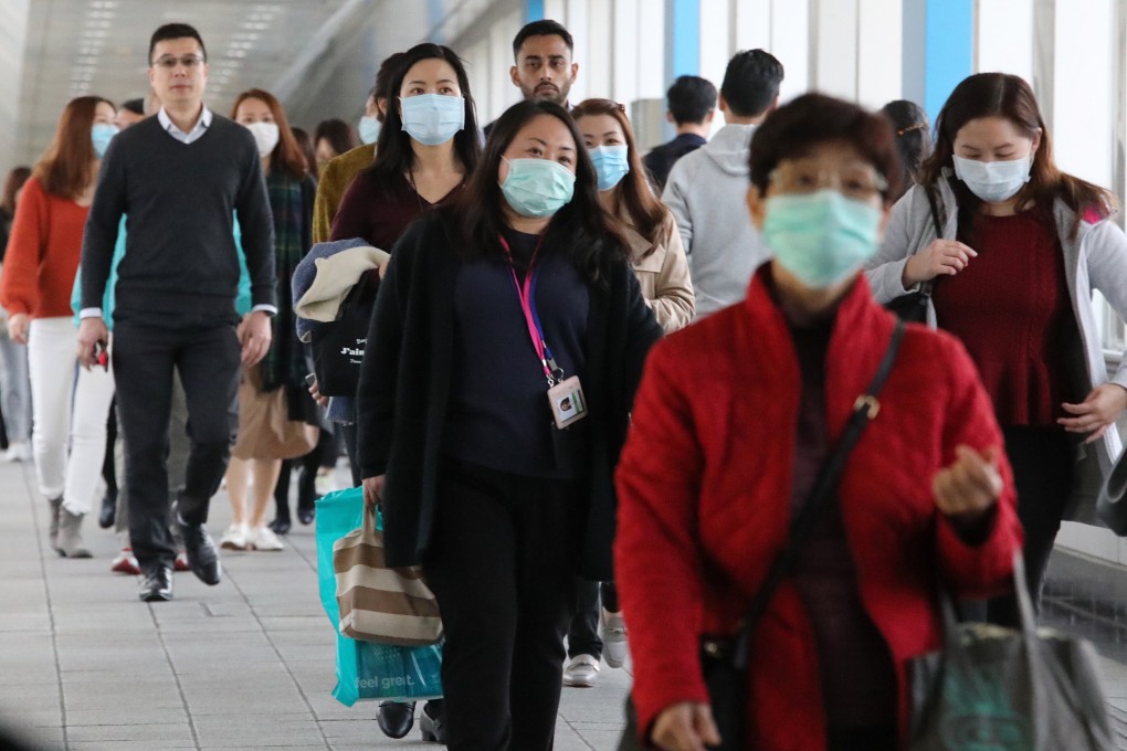 Office workers near HSBC’s headquarters in Central on 21January 2020. Photo: Felix Wong