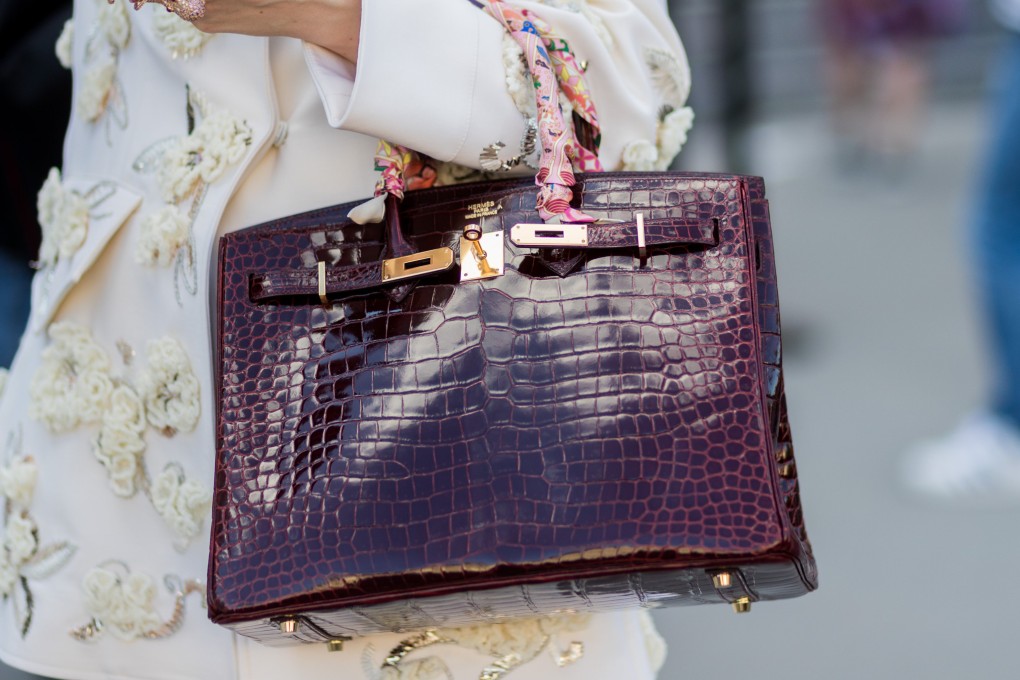 A Paris fashion week guest carries an Hermès bag. Like that luxury house, Chanel has begun limiting customer purchases to maintain exclusivity and drive demand. Photo: Getty Images