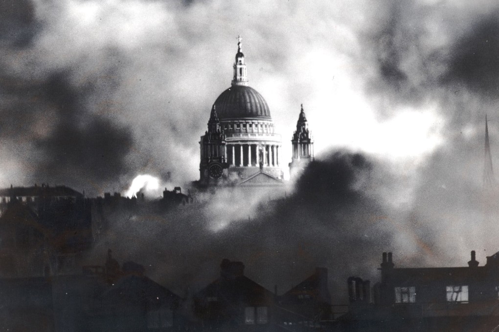 Flames and smoke surround the dome of St. Paul’s Cathedral in London in 1940. The writer’s parents were evacuated from the British capital during WWII. Photo: AP/Daily Mail, Herbert Mason