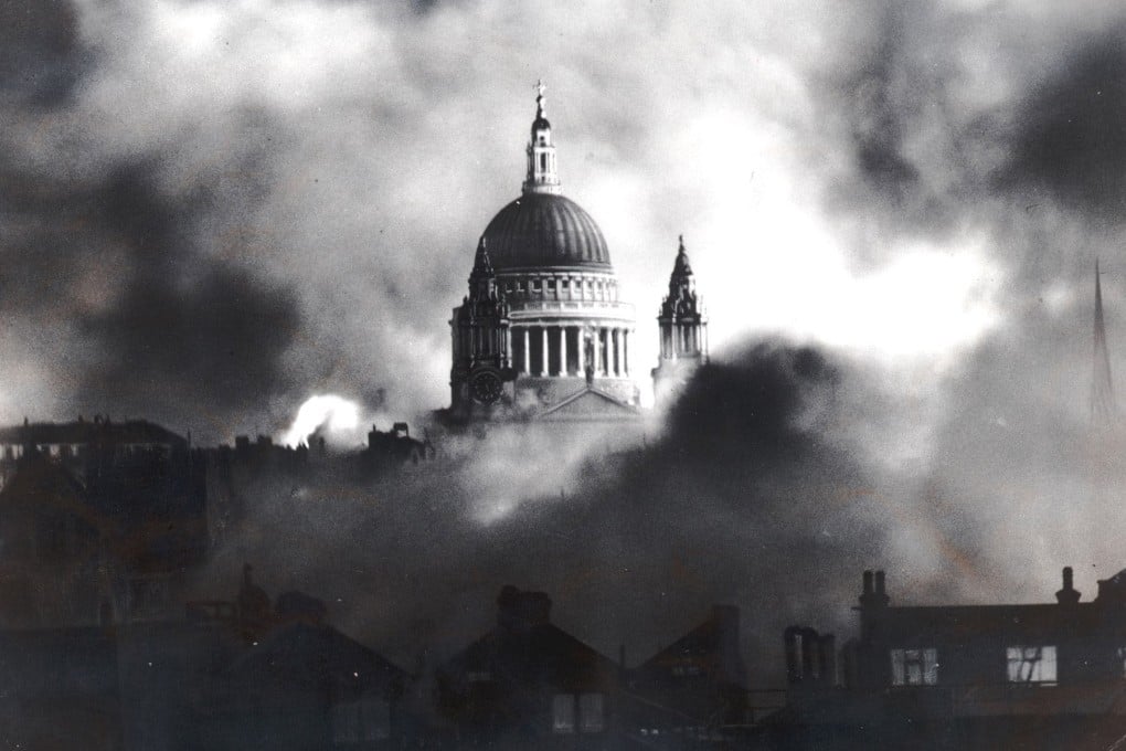 Flames and smoke surround the dome of St. Paul’s Cathedral in London in 1940. The writer’s parents were evacuated from the British capital during WWII. Photo: AP/Daily Mail, Herbert Mason